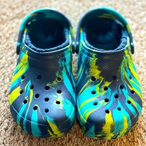 Green and light blue and dark blue crocs size big boy 5